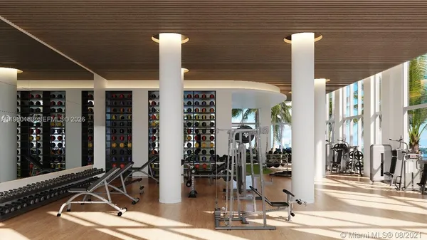 a view of a building with sitting area and potted plants