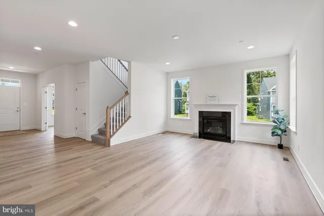 a kitchen with kitchen island a dining table chairs sink and cabinets