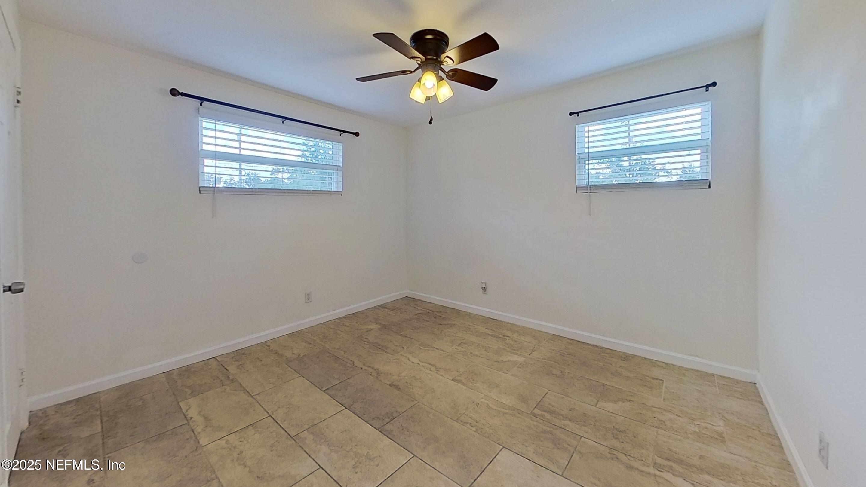 399 Toccoa Road Orange Park, FL 32073 - Photo 21 of 31 a view of an empty room with a window