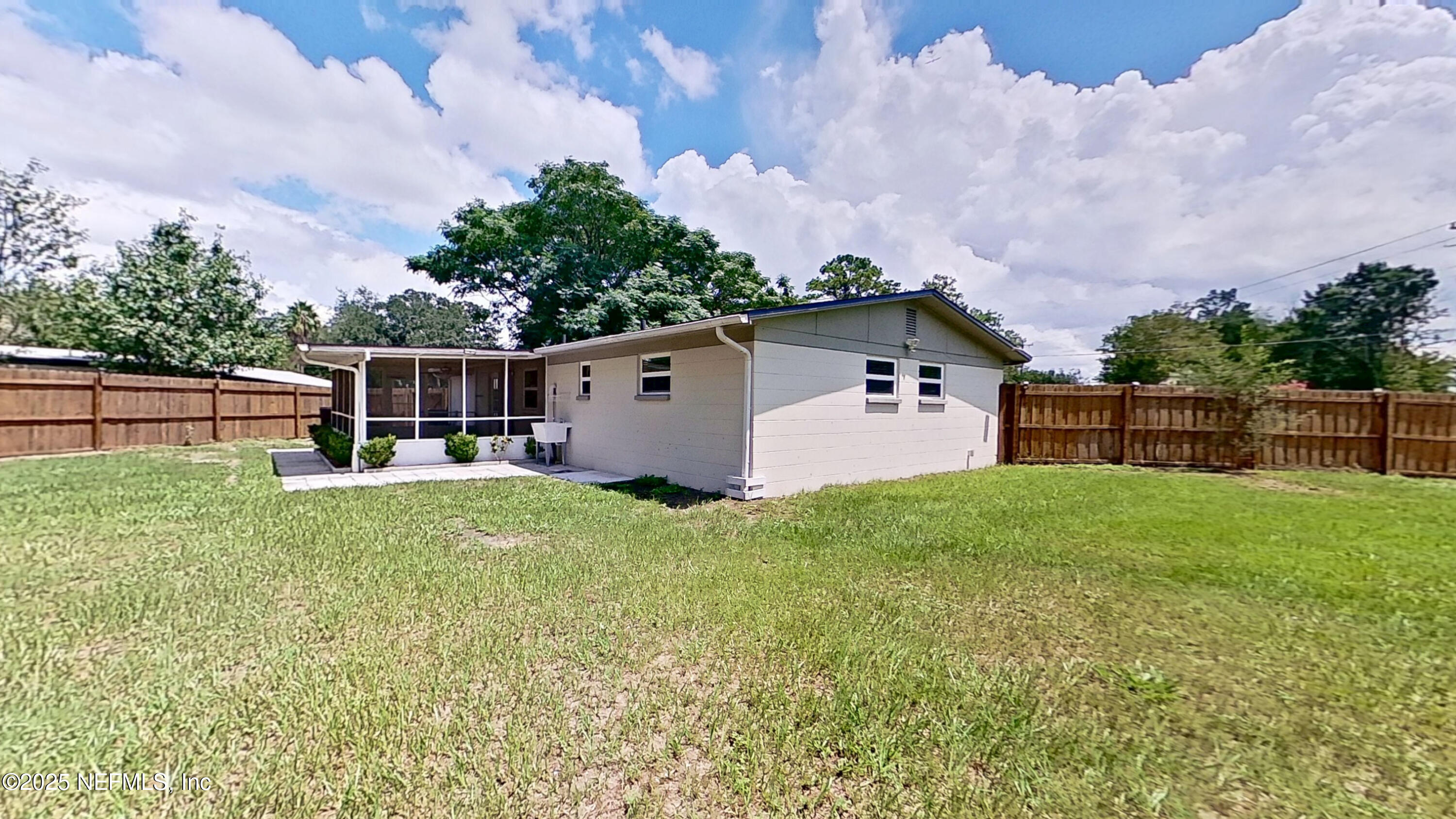 399 Toccoa Road Orange Park, FL 32073 - Photo 27 of 31 a backyard of a house with lots of green space