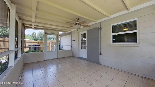 a view of a kitchen with furniture and windows