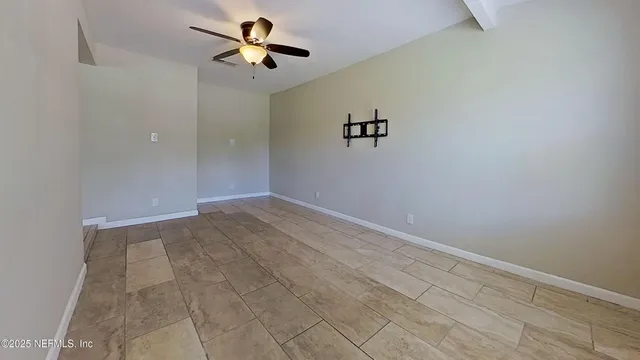 a view of a room with a hanging light