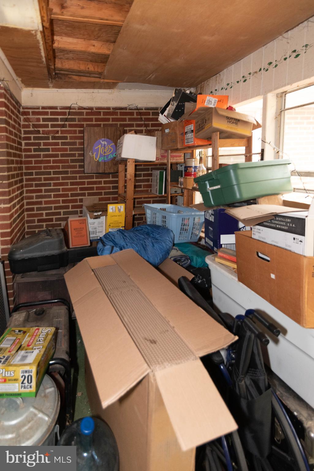 3270 Woodcox Road Indian Head, MD 20640 - Photo 24 of 49 a view of a patio with table and chairs a barbeque with wooden floor