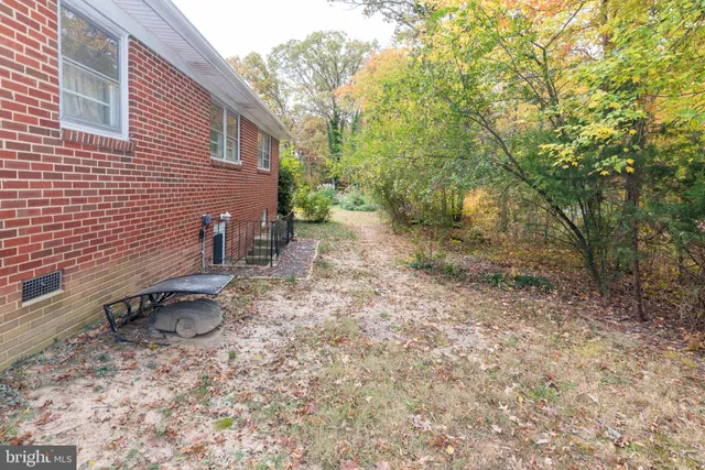 a backyard of a house with outdoor seating