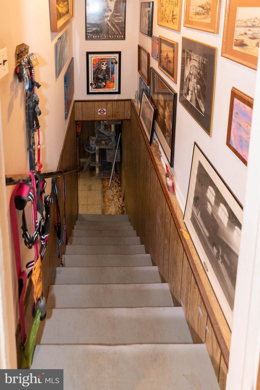 3270 Woodcox Road Indian Head, MD 20640 - Photo 30 of 49 a view of staircase with lots of frames on wall and a chandelier