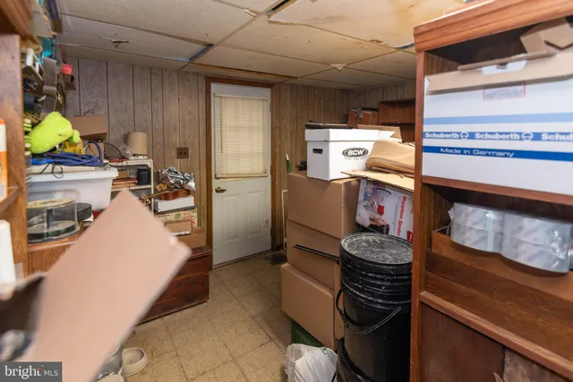 a kitchen with a refrigerator and a stove
