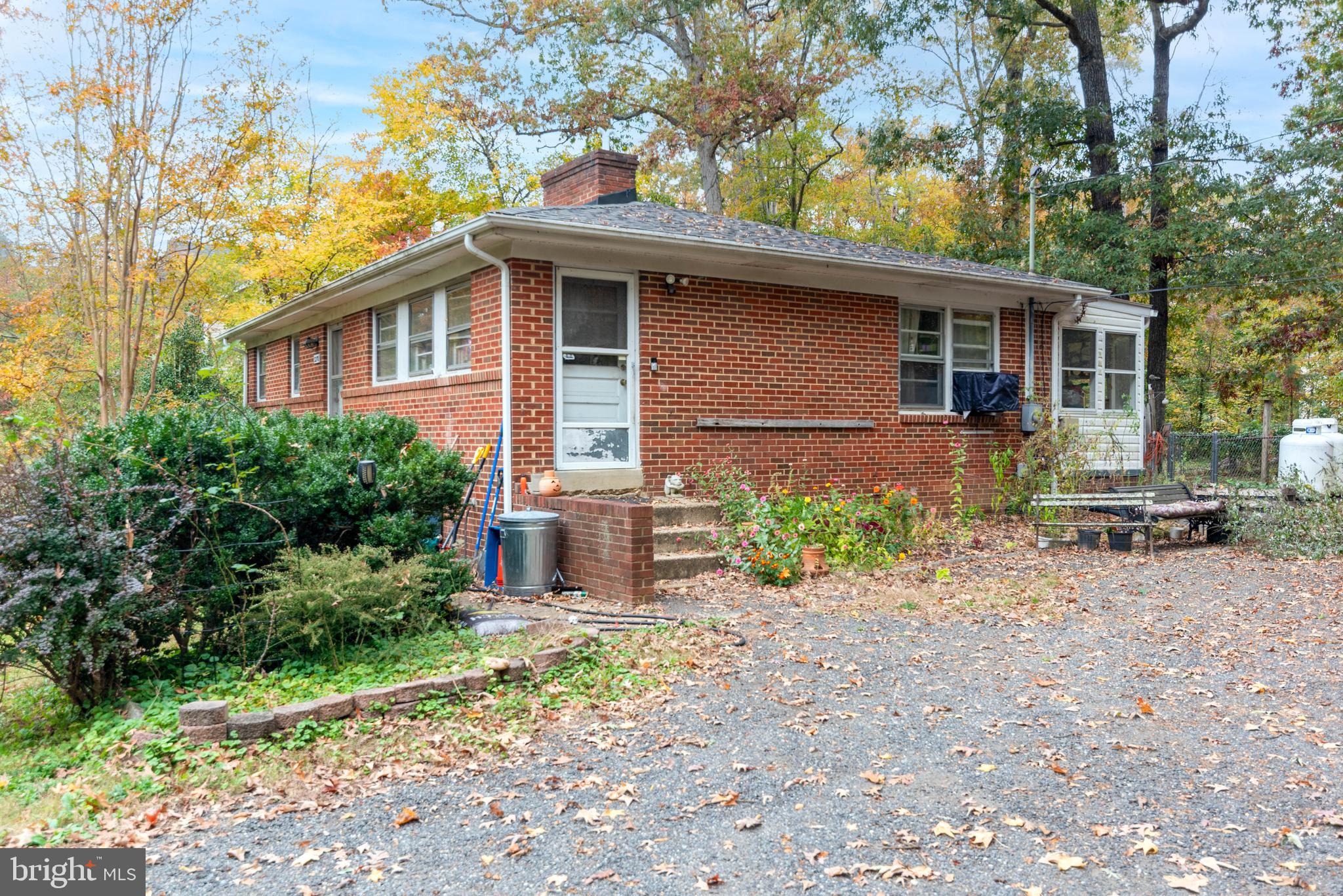 3270 Woodcox Road Indian Head, MD 20640 - Photo 4 of 49 a front view of a house with garden