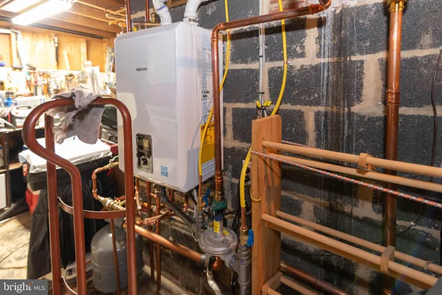a view of walk in closet with clothes and water camper