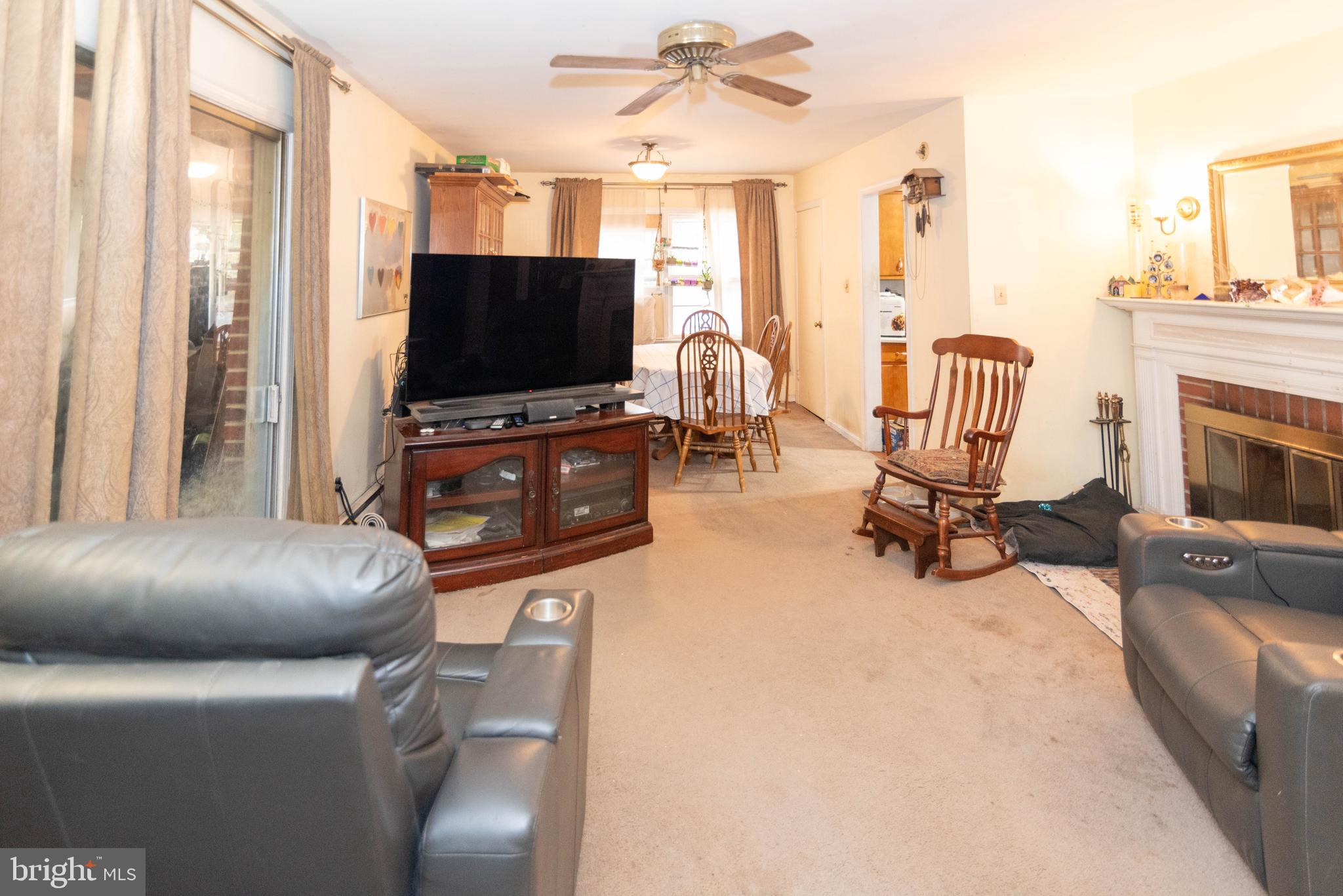 3270 Woodcox Road Indian Head, MD 20640 - Photo 6 of 49 a living room with furniture and a flat screen tv