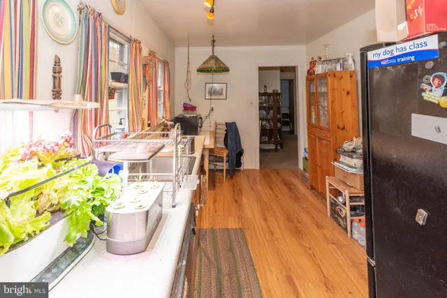 a very nice looking room with wooden floor and furniture