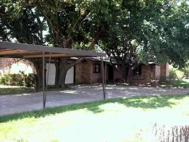 1515 Ave I Ralls, TX 79357 - Photo 1 of 1 a front view of a house with garden