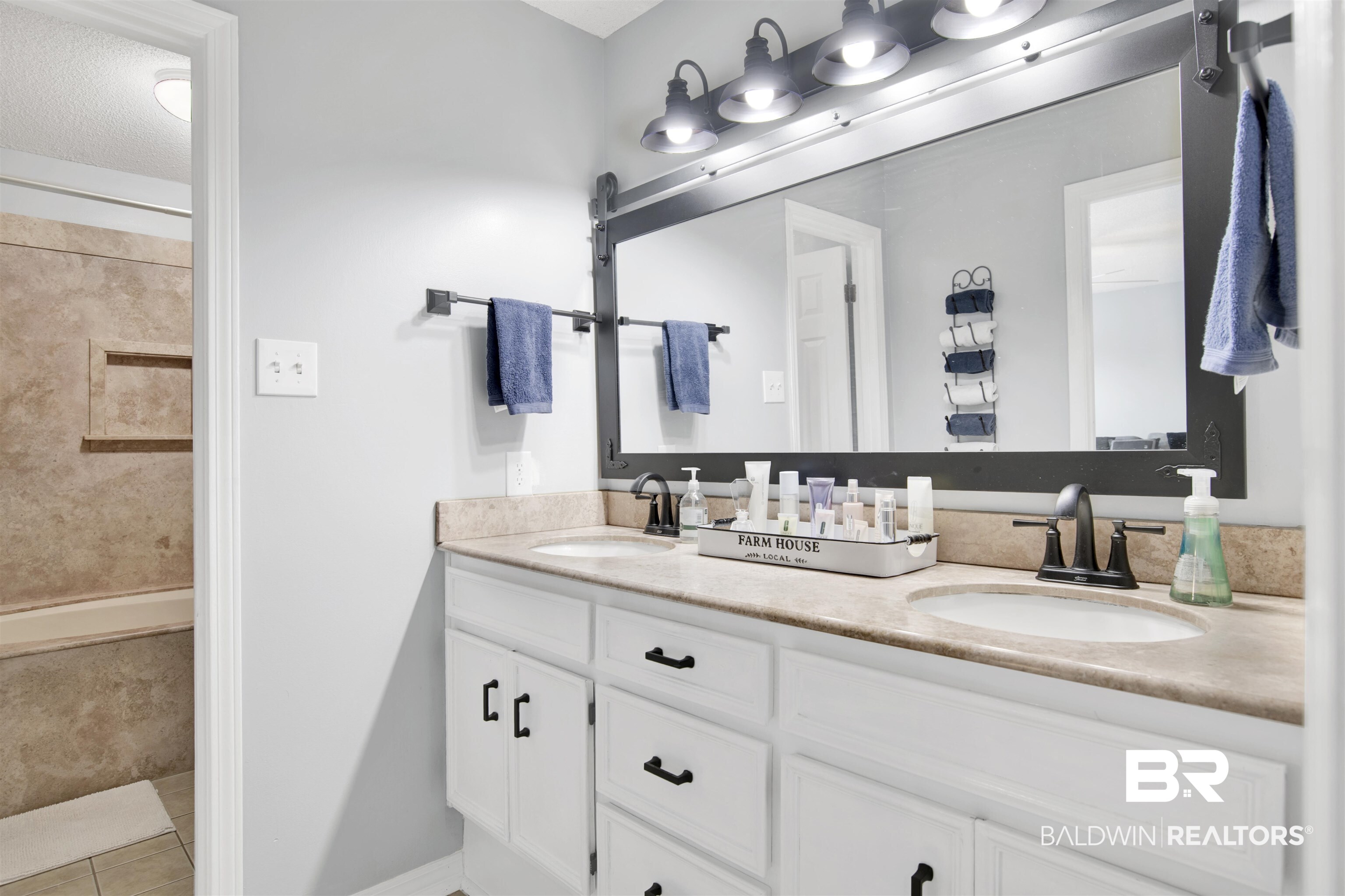 7431 Summer Court Mobile, AL 36695 - Photo 28 of 37 Bathroom with double vanity, tile patterned flooring, and a tile shower