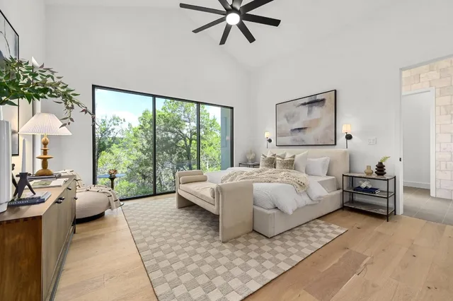 a bathroom with a double vanity sink a mirror and a bathtub