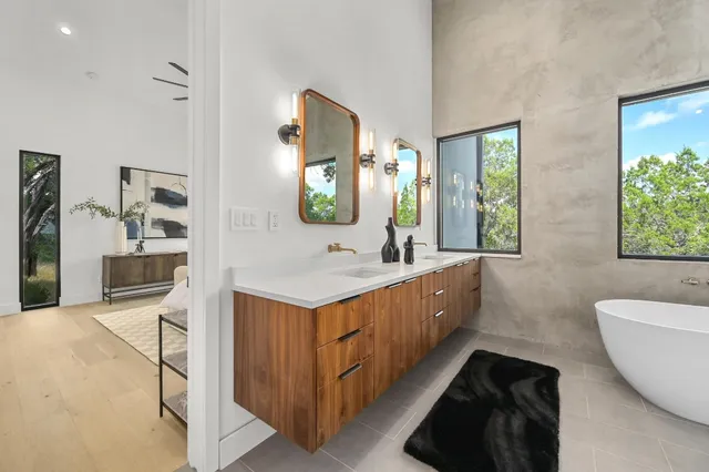 a bathroom with a bathtub and window