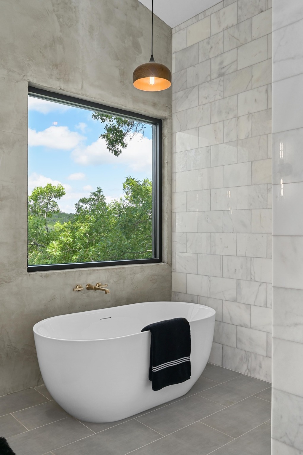 18845 Hidden Ridge Place Jonestown, TX 78645 - Photo 18 of 36 a bathroom with a bathtub and window