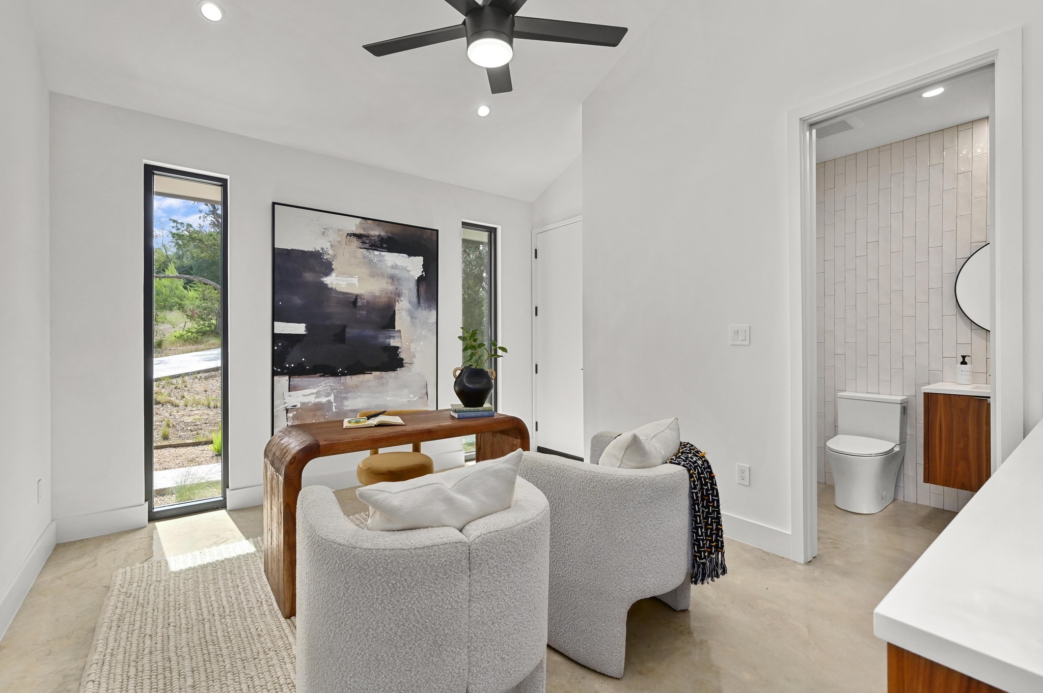 18845 Hidden Ridge Place Jonestown, TX 78645 - Photo 19 of 36 a living room with furniture and a flat screen tv