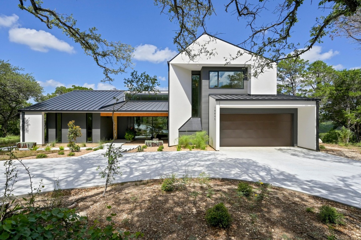 18845 Hidden Ridge Place Jonestown, TX 78645 - Photo 2 of 38 a front view of a house with a yard
