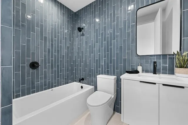 a view of a livingroom with a ceiling fan and window