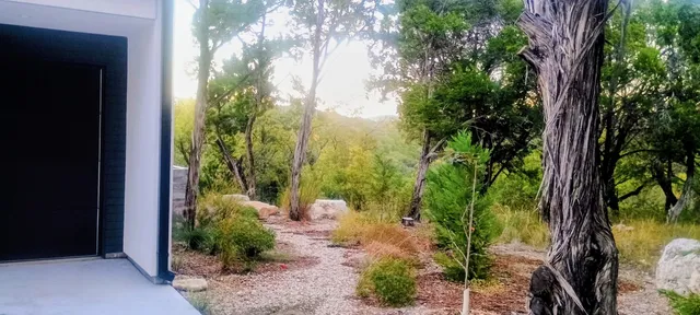 an aerial view of a house with garden space