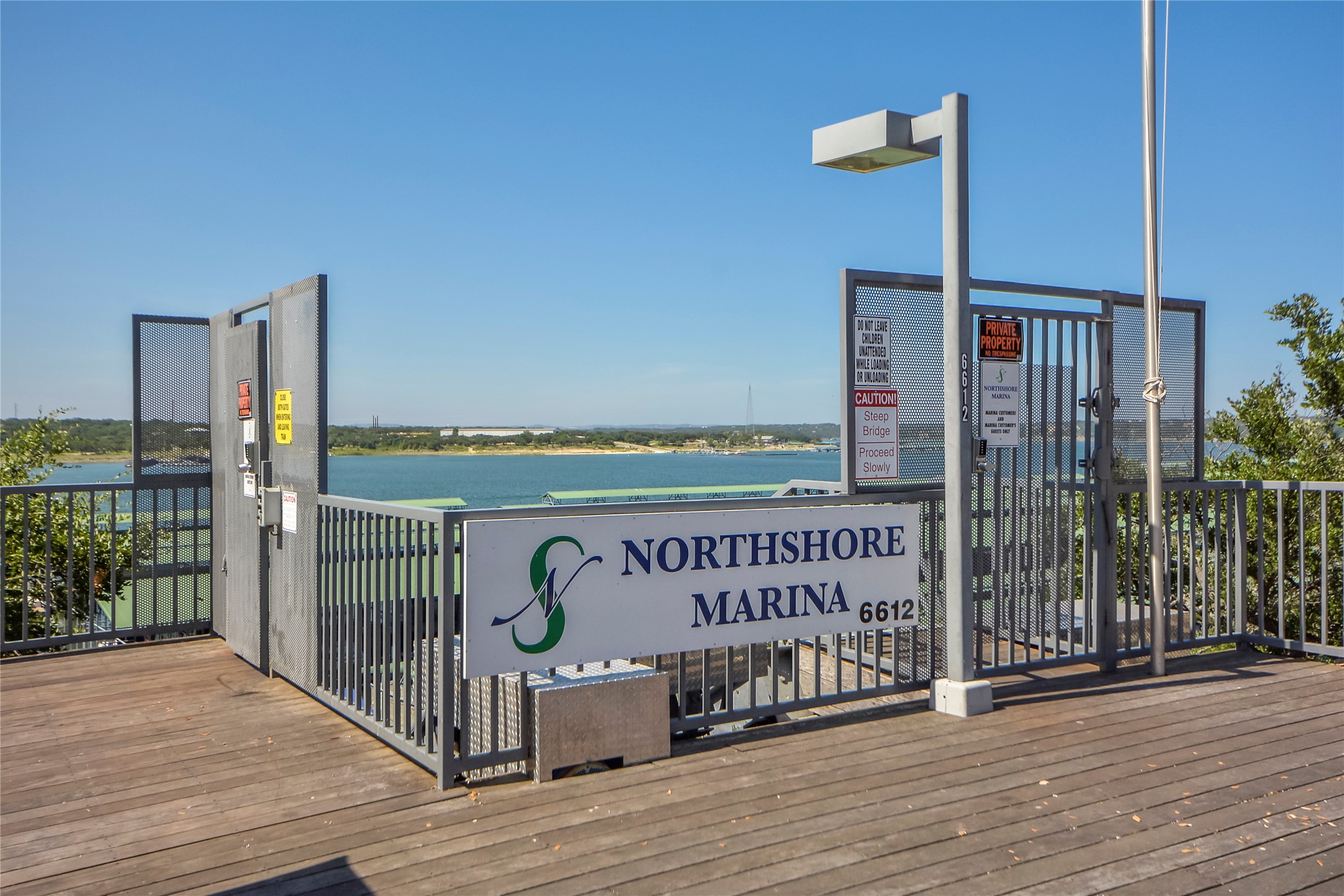 18845 Hidden Ridge Place Jonestown, TX 78645 - Photo 33 of 36 a view of a street with wooden fence