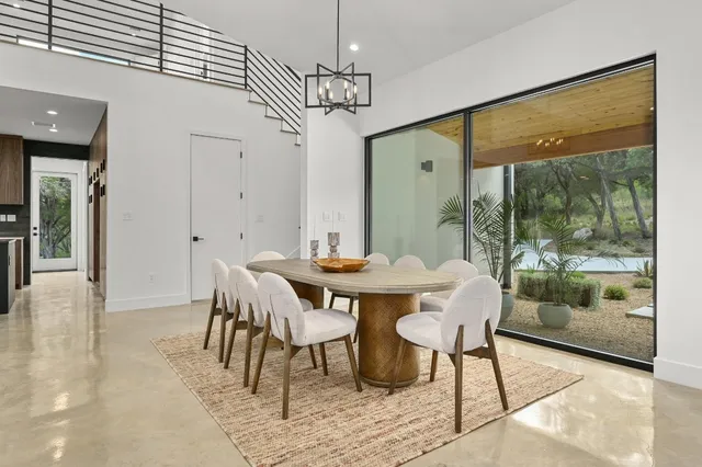 a view of a dining room with furniture window and outside view