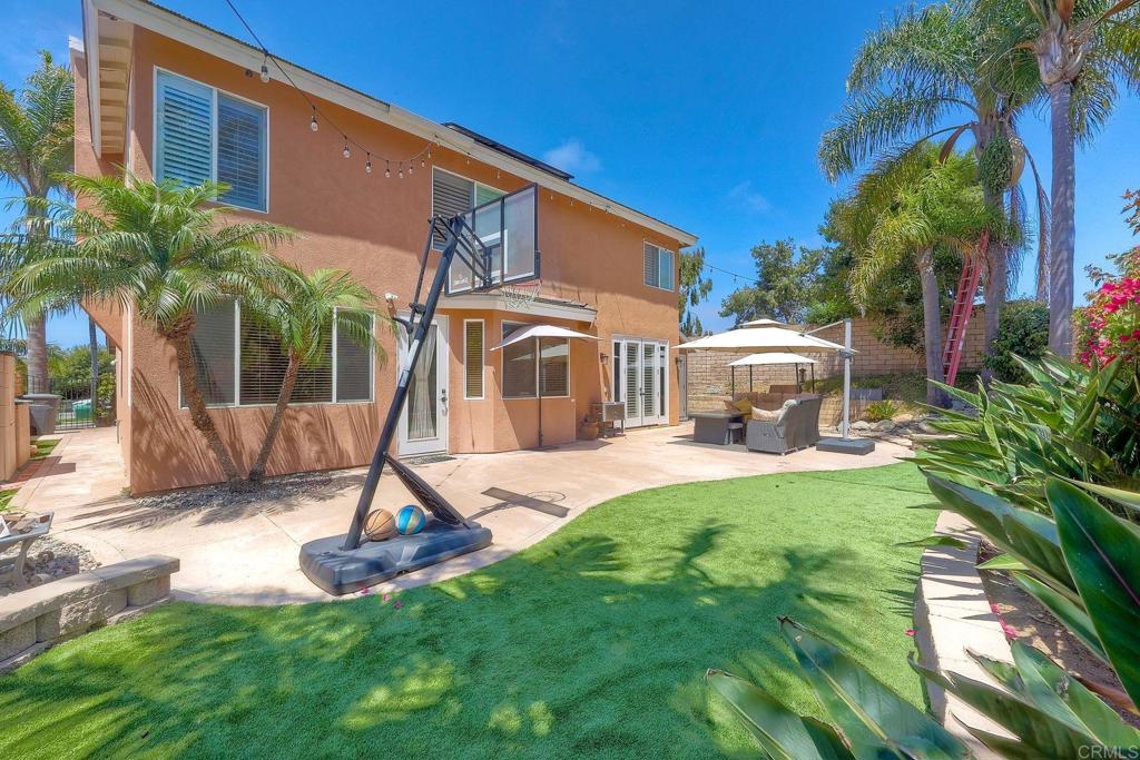 6738 Solandra Drive Carlsbad, CA 92011 - Photo 11 of 11 a front view of a house with garden and deck