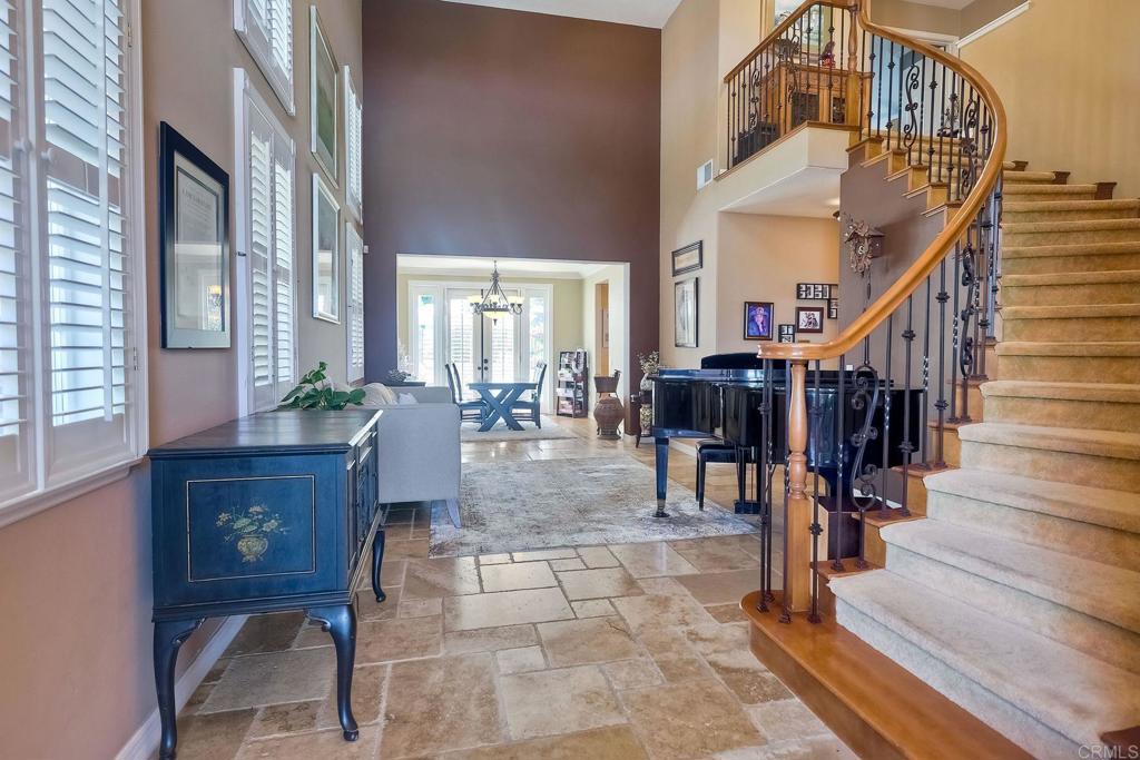 6738 Solandra Drive Carlsbad, CA 92011 - Photo 5 of 11 a view of entryway and hall with wooden floor