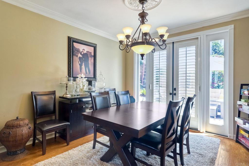 6738 Solandra Drive Carlsbad, CA 92011 - Photo 7 of 11 a view of a dining room with furniture window and wooden floor