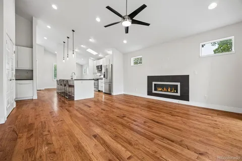 a view of kitchen with cabinets and wooden floor