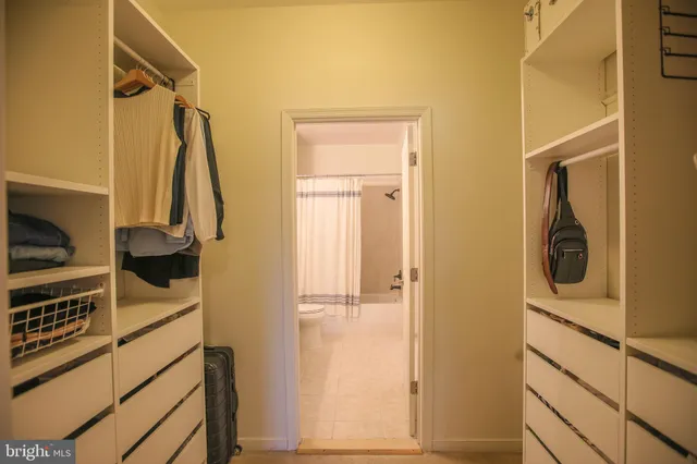 a bathroom with a shower and a sink