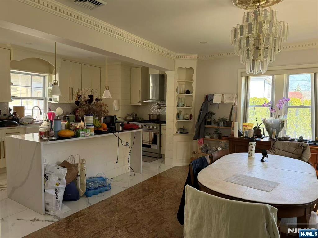 255 Bluff Road Fort Lee, NJ 07024 - Photo 5 of 14 a kitchen with sink a faucet and chairs