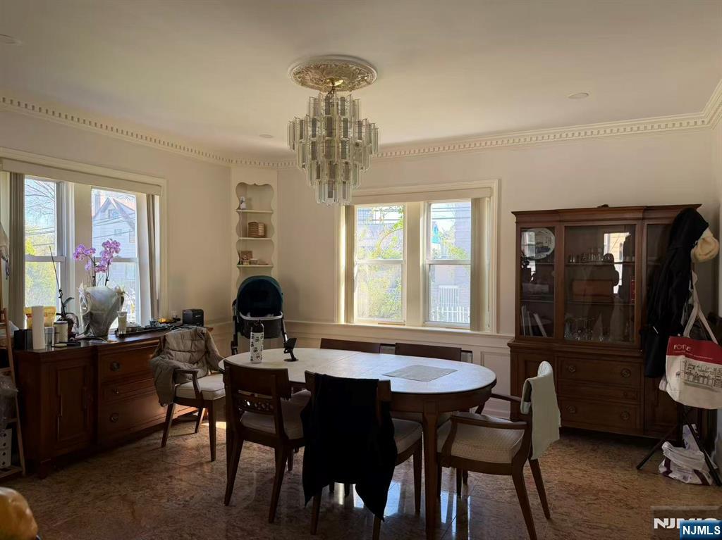 255 Bluff Road Fort Lee, NJ 07024 - Photo 7 of 14 a view of a dining room with furniture and chandelier