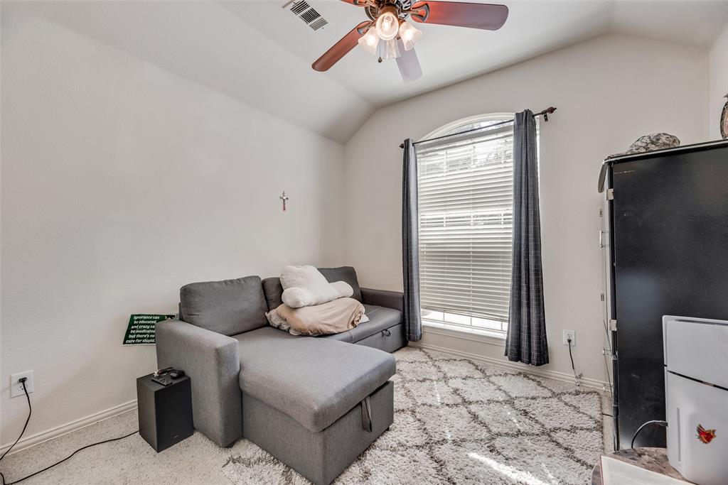 6810 Amesbury Lane Rowlett, TX 75089 - Photo 11 of 22 a living room with furniture and a flat screen tv