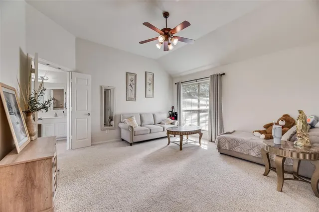 a living room with furniture and white walls