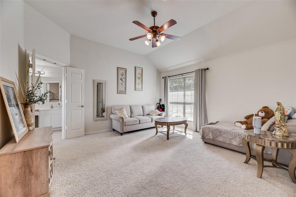 6810 Amesbury Lane Rowlett, TX 75089 - Photo 12 of 22 a living room with furniture and white walls