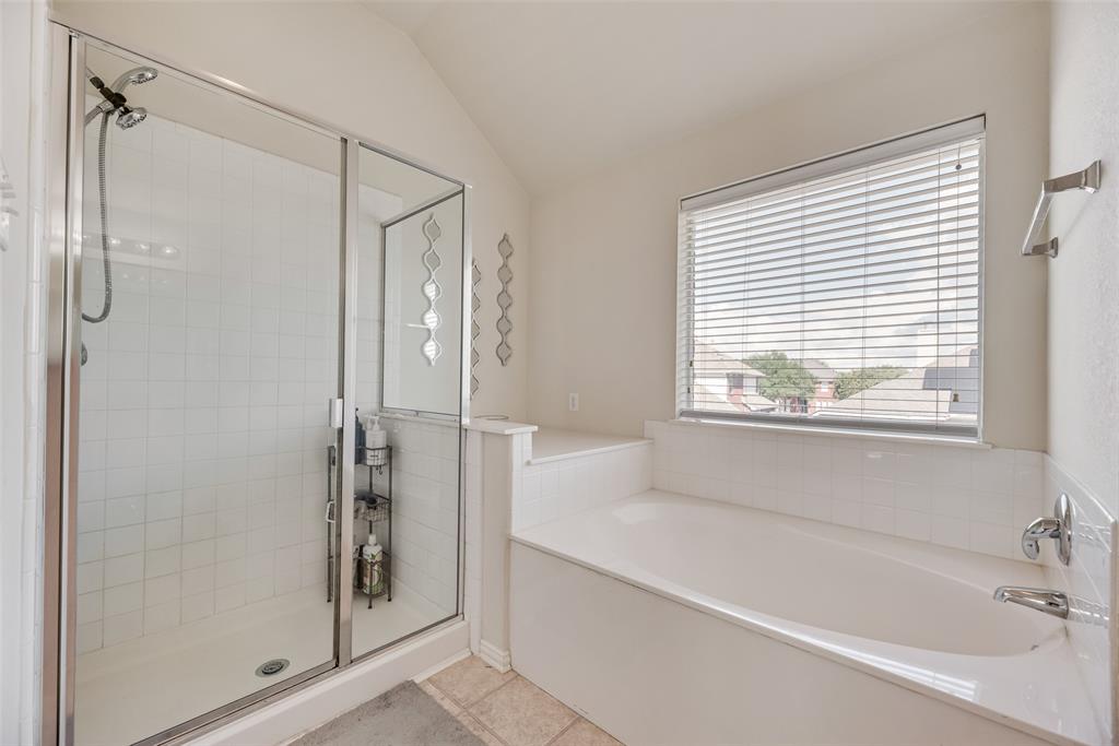 6810 Amesbury Lane Rowlett, TX 75089 - Photo 15 of 22 a bathroom with a bathtub and a shower