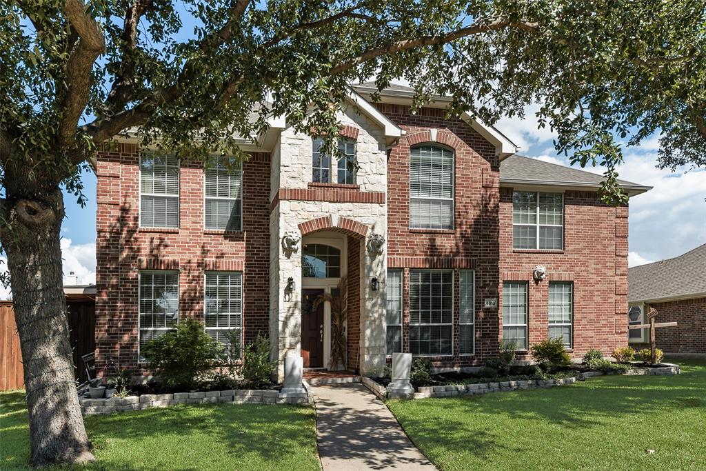 6810 Amesbury Lane Rowlett, TX 75089 - Photo 21 of 22 front view of a house with a yard