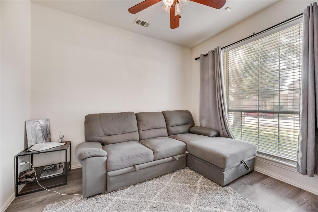 6810 Amesbury Lane Rowlett, TX 75089 - Photo 4 of 22 a living room with furniture and a large window