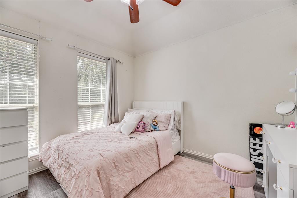 6810 Amesbury Lane Rowlett, TX 75089 - Photo 9 of 22 a bedroom with a bed and a window