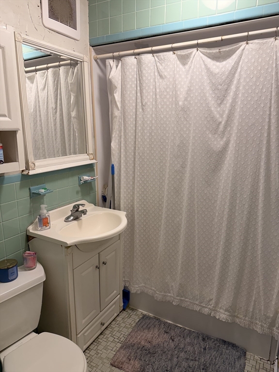 49 Sunset Road, Unit 49 Somerville, MA 02144 - Photo 12 of 24 a bathroom with a sink and toilet