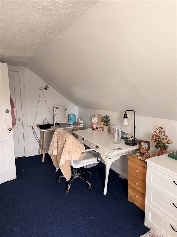49 Sunset Road, Unit 49 Somerville, MA 02144 - Photo 18 of 24 a bed room with a bed and a table