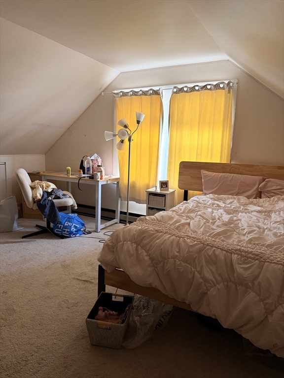 49 Sunset Road, Unit 49 Somerville, MA 02144 - Photo 21 of 24 a bedroom with a bed and a window