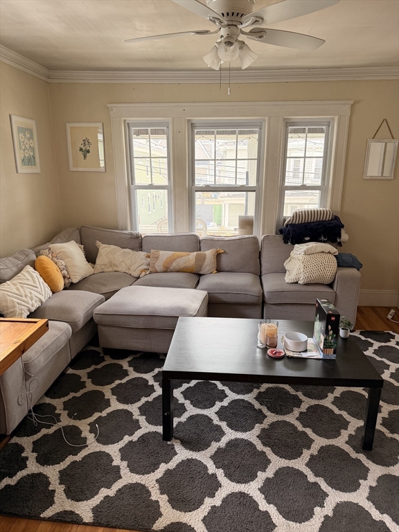 49 Sunset Road, Unit 49 Somerville, MA 02144 - Photo 3 of 24 a living room with furniture and a window