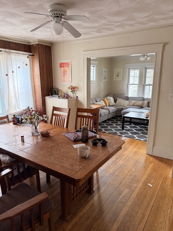 49 Sunset Road, Unit 49 Somerville, MA 02144 - Photo 8 of 24 a living room with furniture and a wooden floor