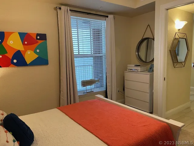 a kitchen with a table chairs stove and kitchen island
