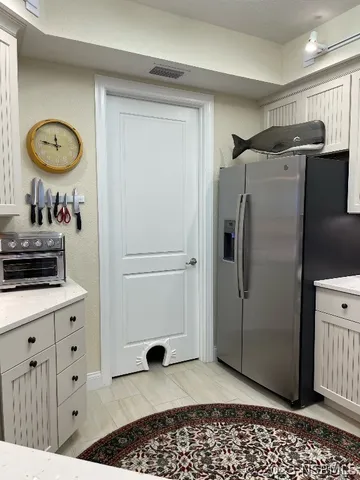 a view of a balcony with furniture and a potted plant