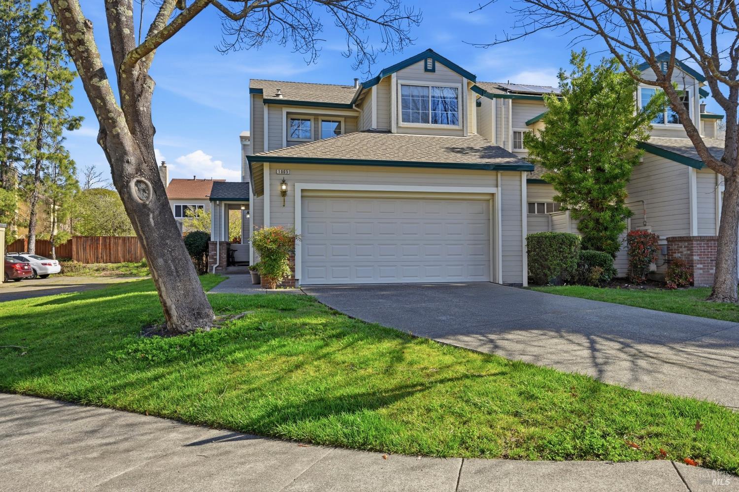 1005 Woodlake Drive Santa Rosa, CA 95405 - Photo 1 of 28 a front view of a house with a yard and garage