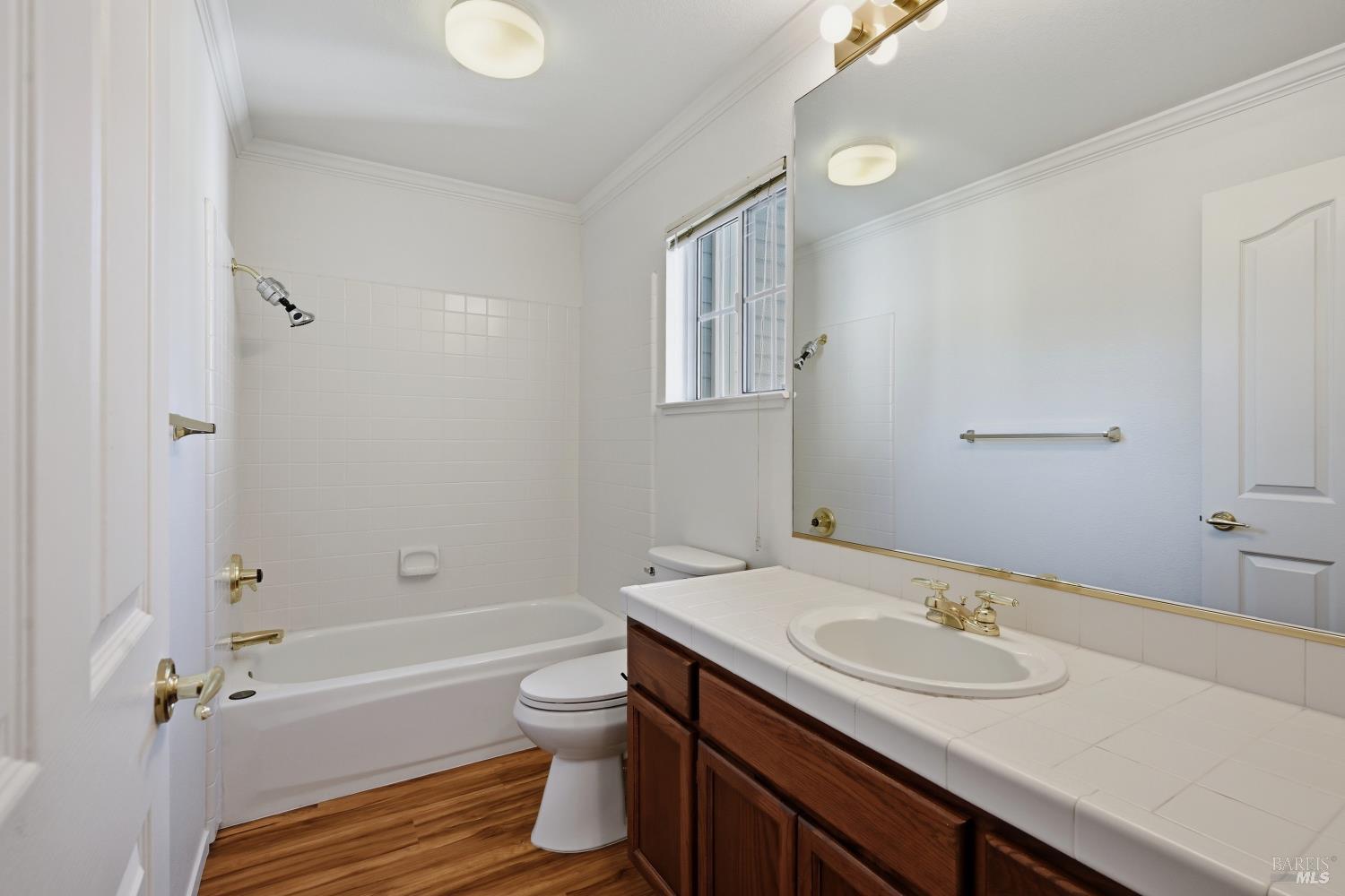 1005 Woodlake Drive Santa Rosa, CA 95405 - Photo 18 of 28 a bathroom with a granite countertop sink toilet and shower