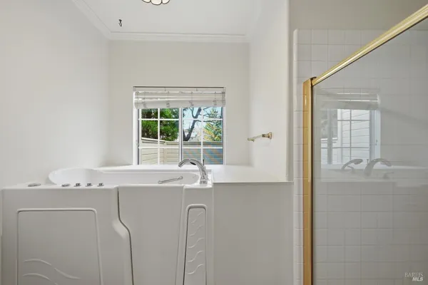 a view of a hallway with wooden floor and stairs