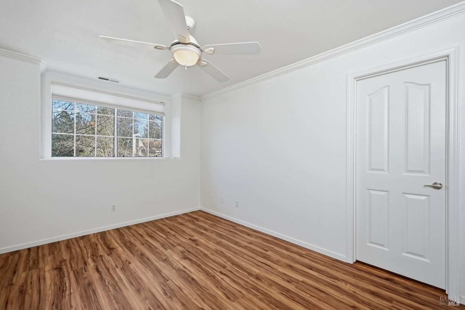 1005 Woodlake Drive Santa Rosa, CA 95405 - Photo 20 of 28 wooden floor in an empty room with a window